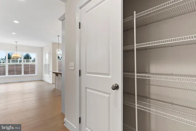 a view of a walk in closet and bedroom