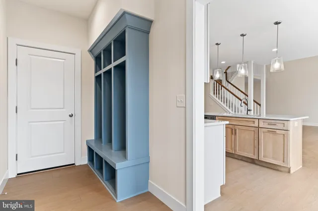 a view of a kitchen cabinets and a room