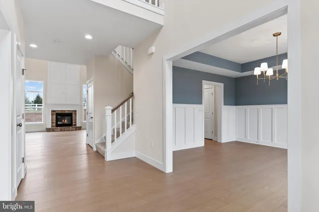 a view of a livingroom with an entryway and fireplace