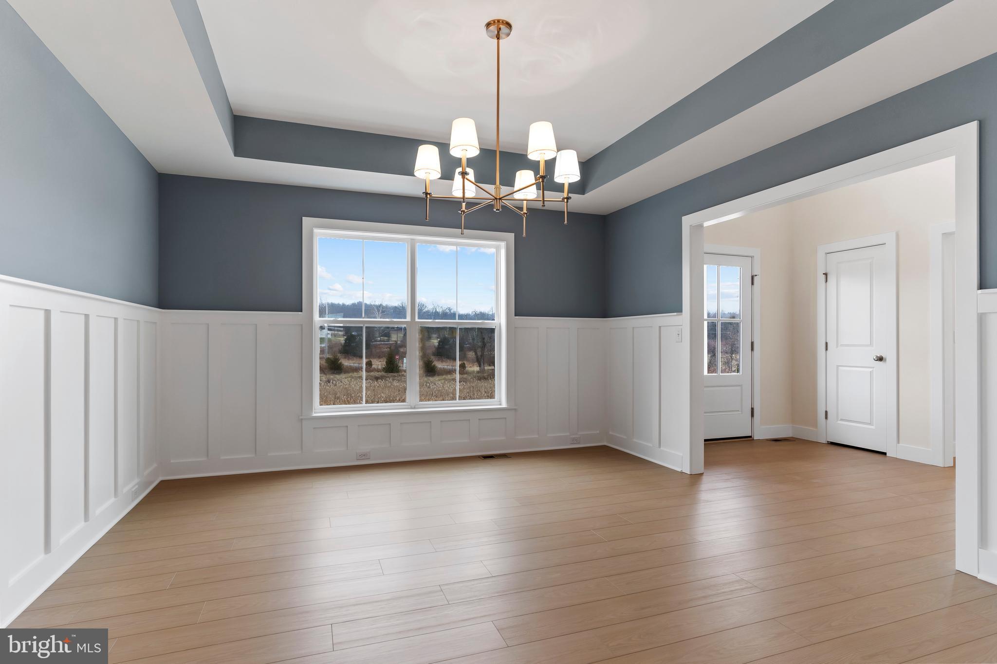 302 Cedar Road Dillsburg, PA 17019 - Photo 20 of 54 a view of an empty room with wooden floor and a window