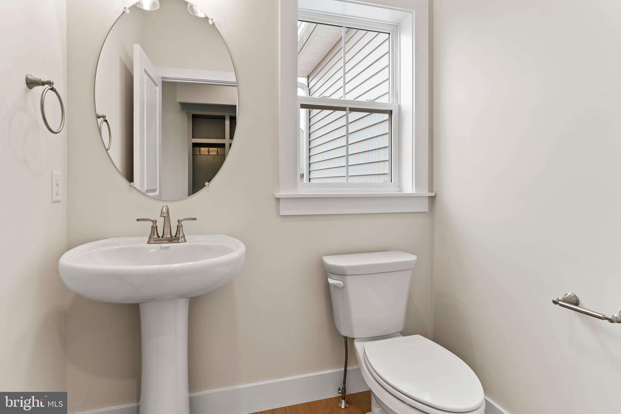 302 Cedar Road Dillsburg, PA 17019 - Photo 23 of 54 a bathroom with a toilet sink and mirror