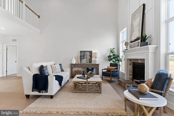 a living room with furniture fireplace and a flat screen tv