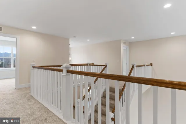 a view of staircase with lots of windows