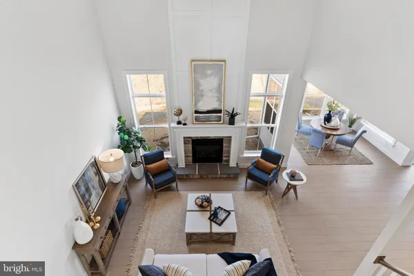 a bedroom with furniture and a large window