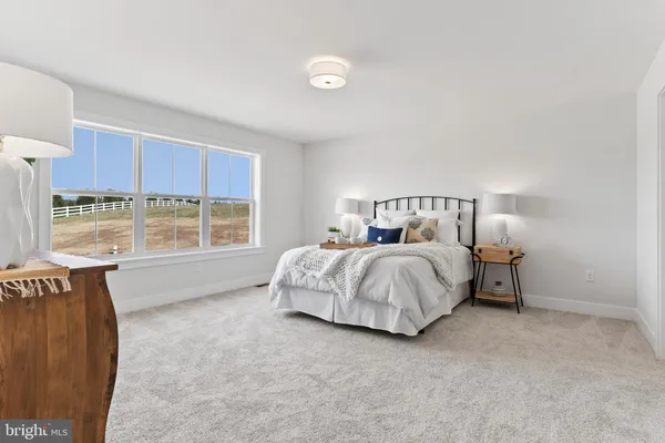 a bed room with a bed and a lamp
