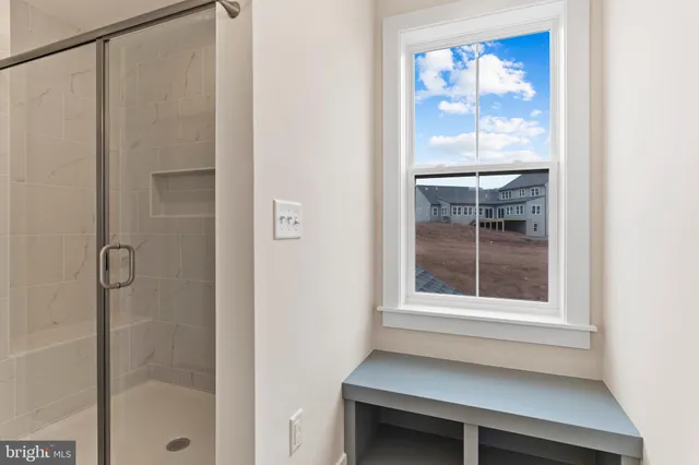 a spacious bathroom with a double vanity sink mirror and double