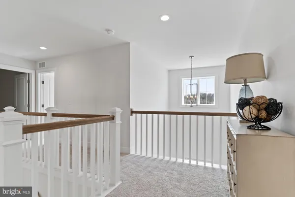 a view of a hallway with staircase