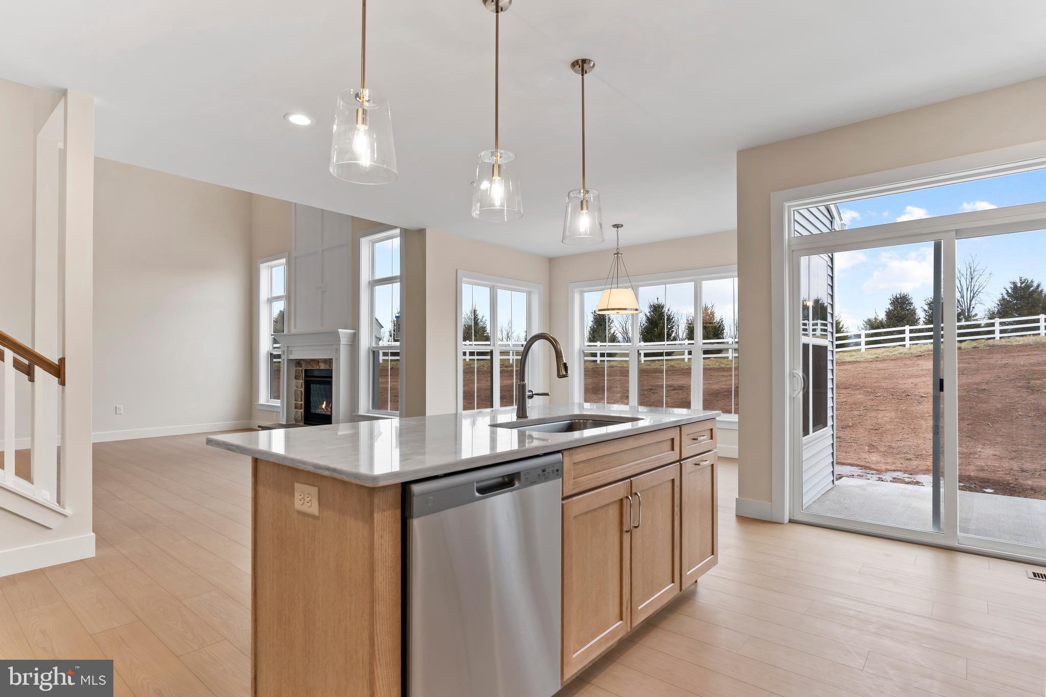 302 Cedar Road Dillsburg, PA 17019 - Photo 6 of 54 a kitchen with stainless steel appliances granite countertop a sink a oven and a view of living room