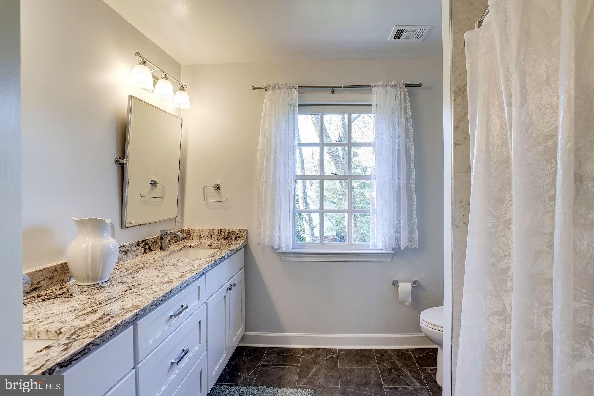 7913 Foxhound Road McLean, VA 22102 - Photo 23 of 37 Renovated Hall Bath