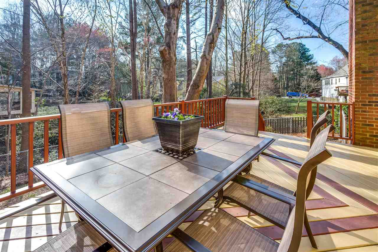 8108 Mourning Dove Road Raleigh, NC 27615 - Photo 6 of 25 RECENTLY STAINED DECK WITH CUSTOM PATTERN IS THE PERFECT SPOT FOR ENTERTAINING! Exterior Back