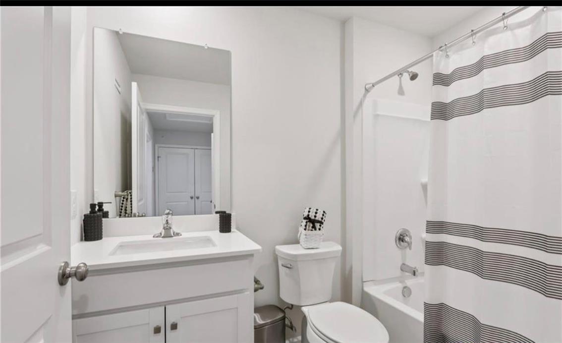 1138 Martin Road Breinigsville, PA 18031 - Photo 8 of 9 A well-appointed bathroom offers a clean and functional design, complete with a shower-tub combination.