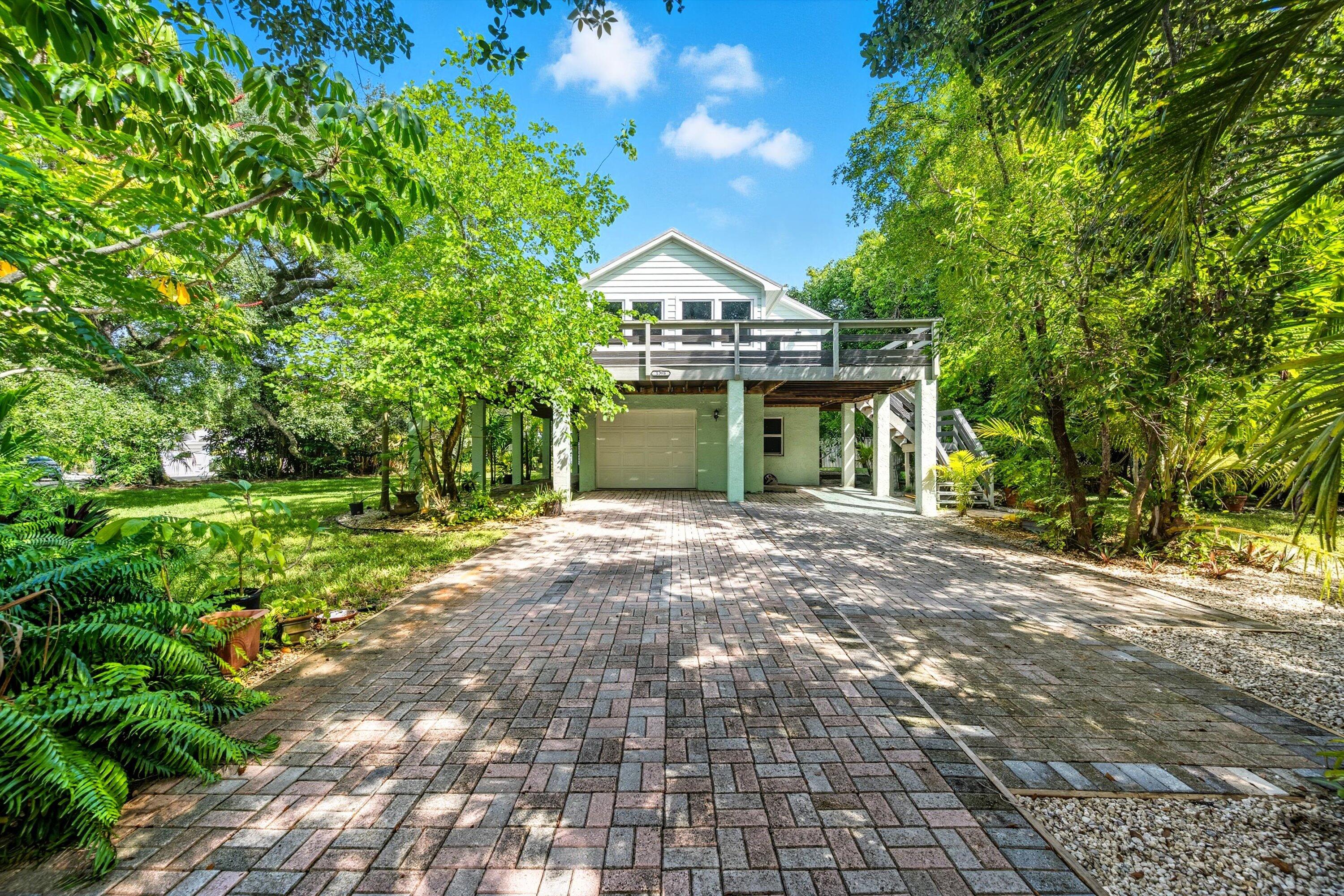 a view of an house with backyard space and garden