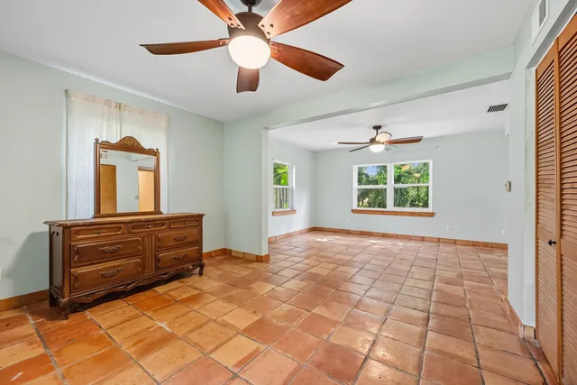 a view of room with window and ceiling fan