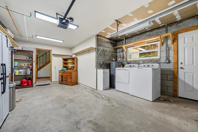 a view of a yard with plants and trees