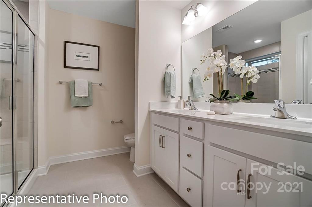 2153 Bexar Trail Matthews, NC 28105 - Photo 29 of 35 a bathroom with a double vanity sink and a mirror