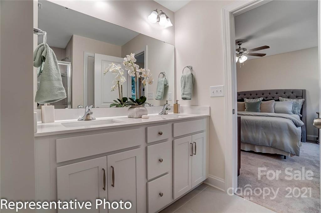2153 Bexar Trail Matthews, NC 28105 - Photo 31 of 35 a en suite bathroom with a double vanity sink and a mirror