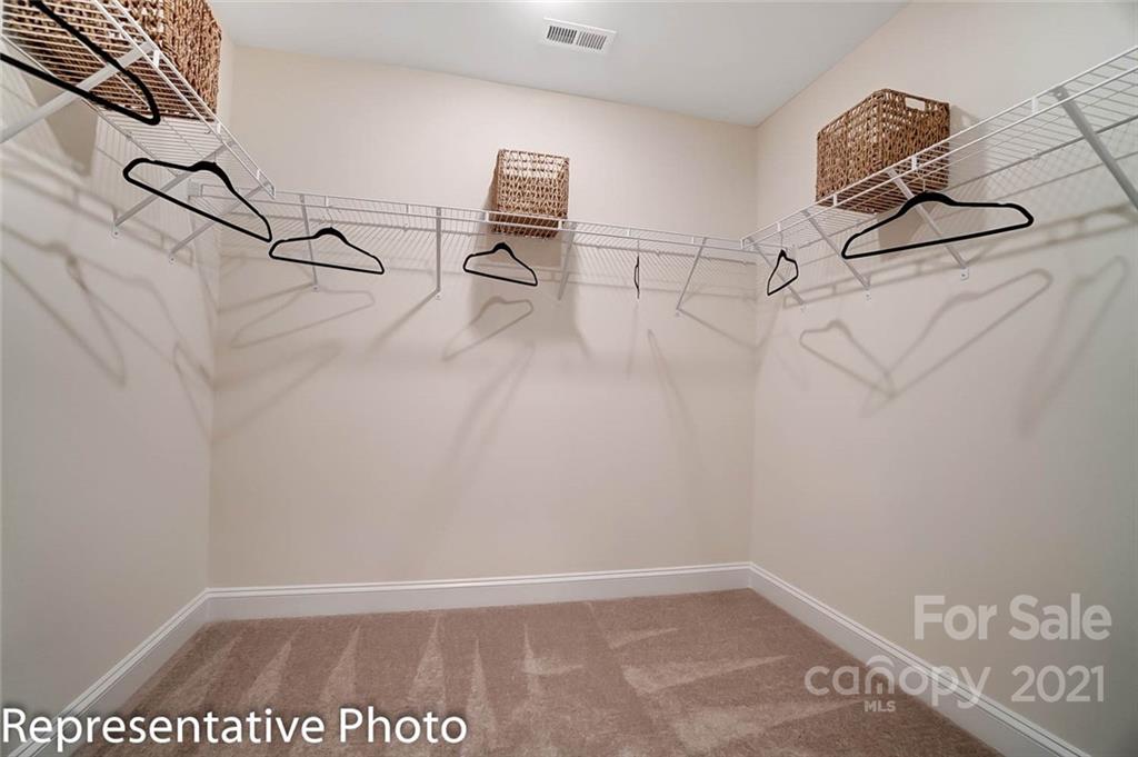2153 Bexar Trail Matthews, NC 28105 - Photo 32 of 35 a view of a room with racks on the wall