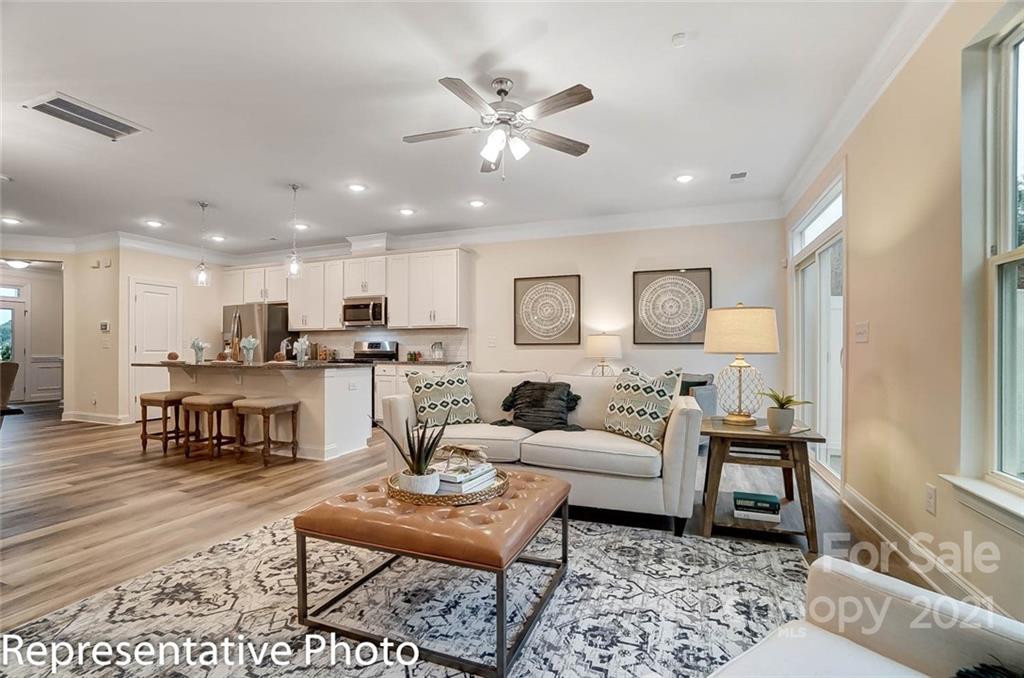 2153 Bexar Trail Matthews, NC 28105 - Photo 6 of 35 a living room with furniture and kitchen view