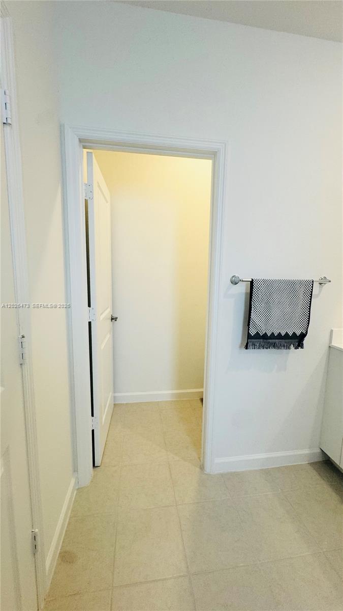 19479 Southwest 340th Street, Unit 1 Homestead, FL 33034 - Photo 18 of 58 a view of a room with an empty space and a sink
