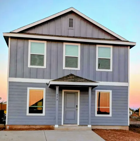 a front view of a house with yard