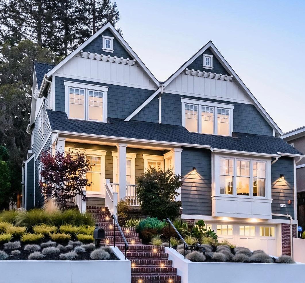 a front view of a house with garden