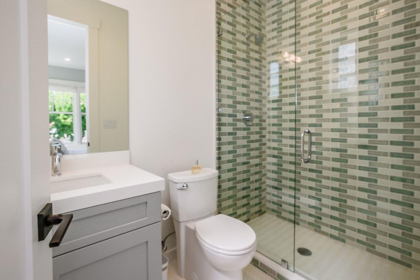 421 Hillcrest Road San Mateo, CA 94402 - Photo 13 of 33 a bathroom with a toilet a sink and a shower