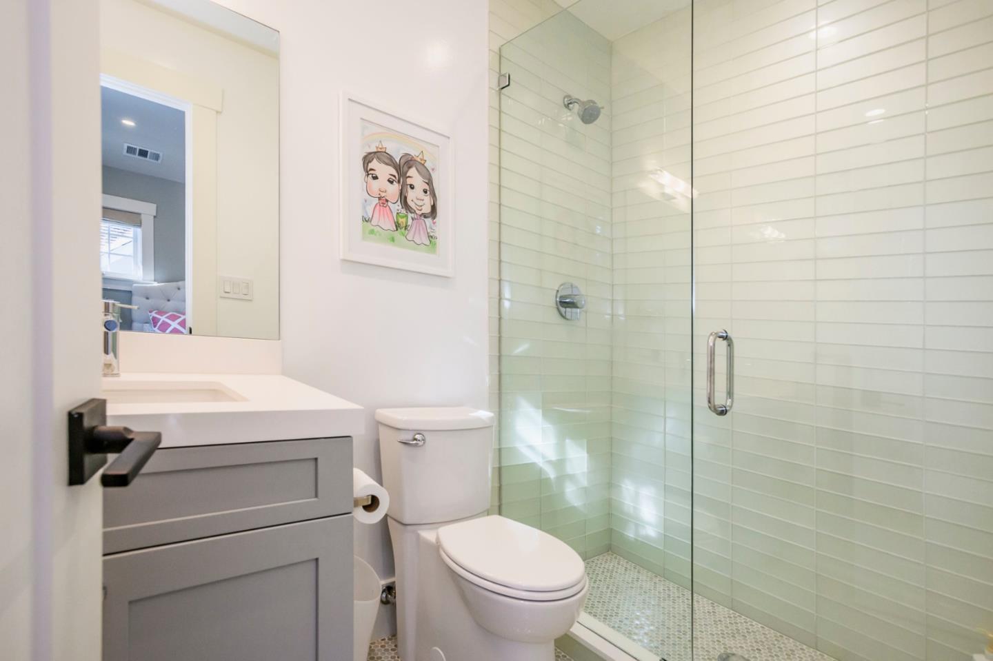 421 Hillcrest Road San Mateo, CA 94402 - Photo 25 of 33 a bathroom with a toilet a sink and shower