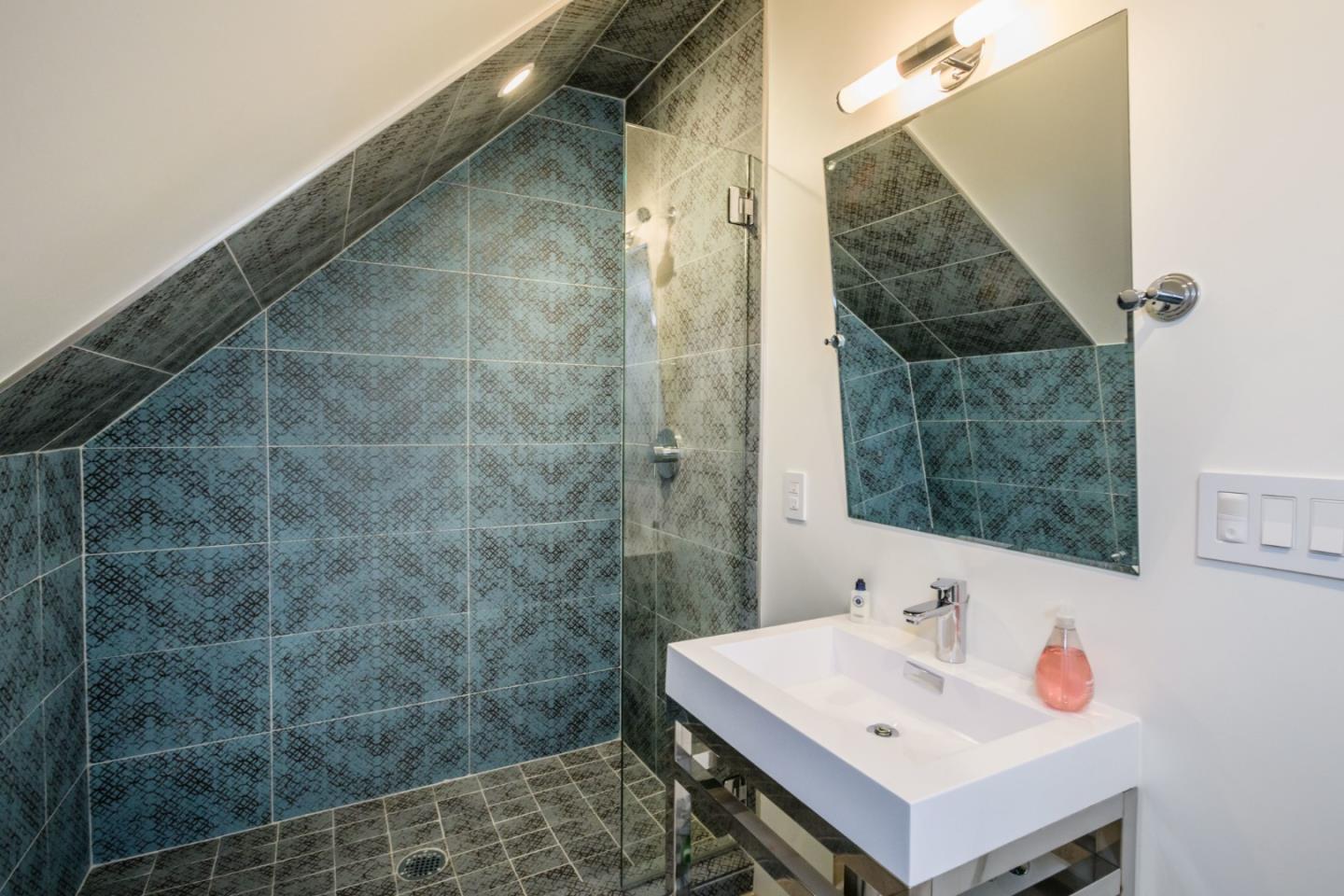 421 Hillcrest Road San Mateo, CA 94402 - Photo 27 of 33 a bathroom with a sink and a mirror