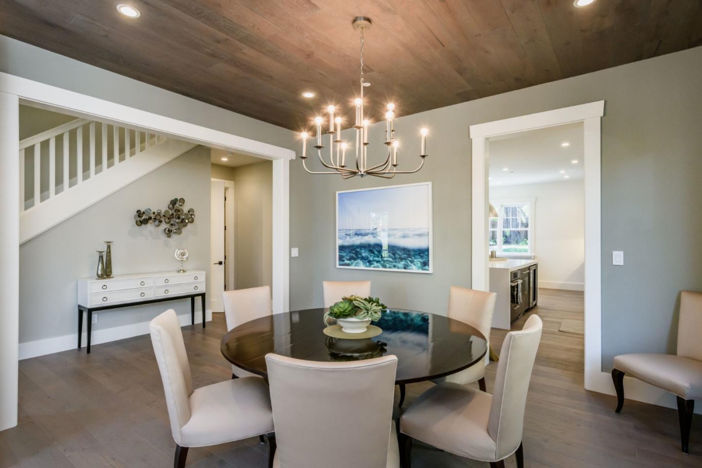 421 Hillcrest Road San Mateo, CA 94402 - Photo 3 of 33 a dining room with furniture a livingroom and chandelier