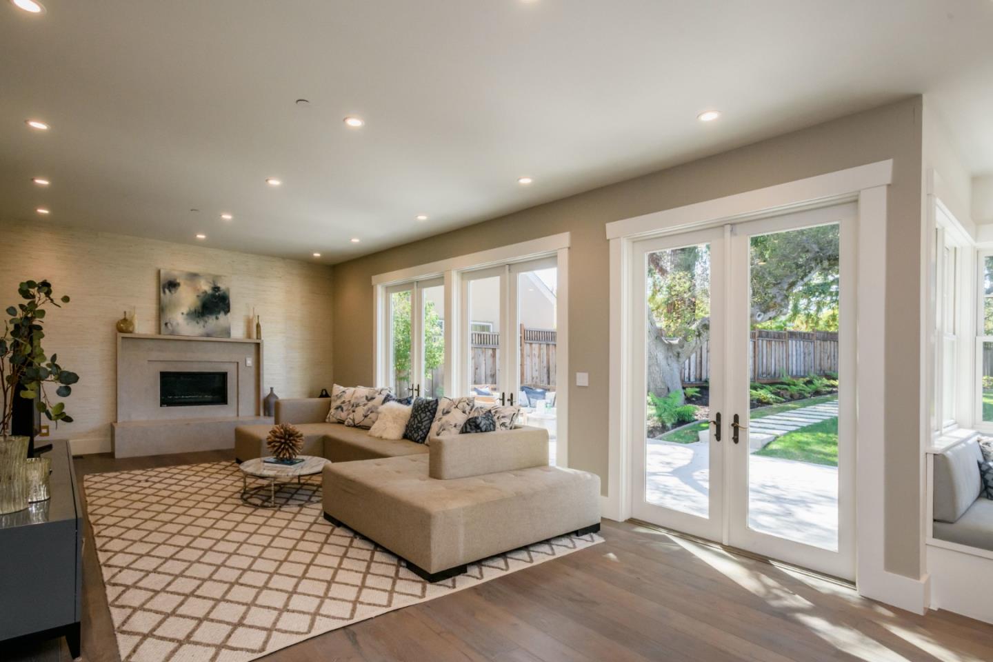 421 Hillcrest Road San Mateo, CA 94402 - Photo 5 of 33 a living room with furniture large window and a fireplace