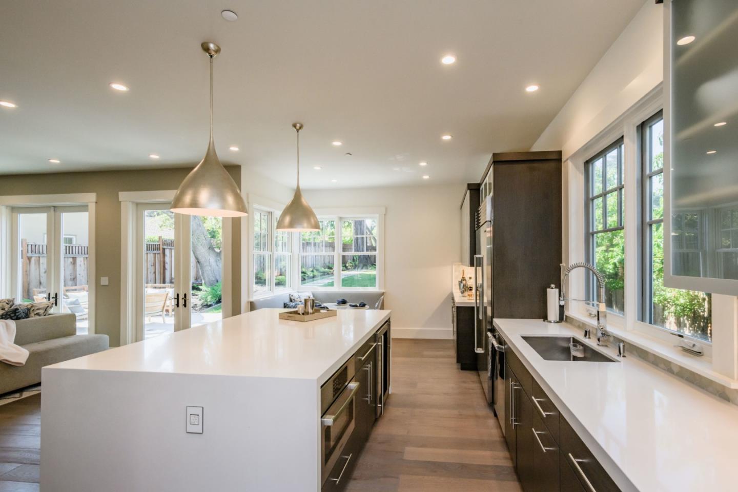 421 Hillcrest Road San Mateo, CA 94402 - Photo 8 of 33 a kitchen with stainless steel appliances a sink stove and large window