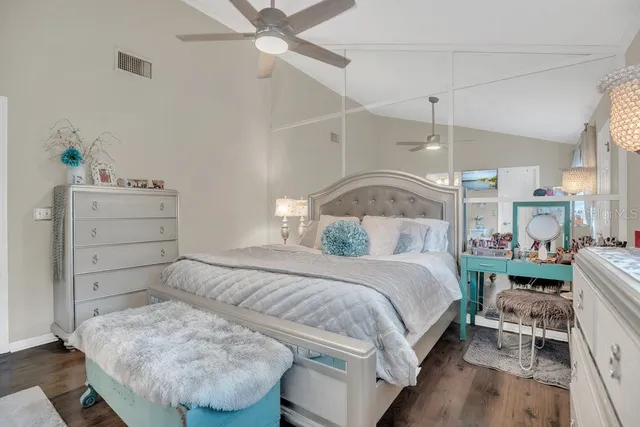 a bedroom with a bed and a table