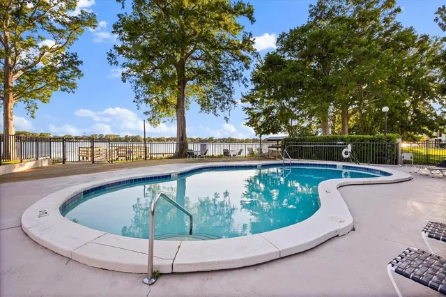 a view of a swimming pool with a lounge chairs
