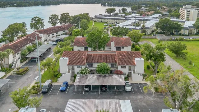 an aerial view of a house with outdoor seating