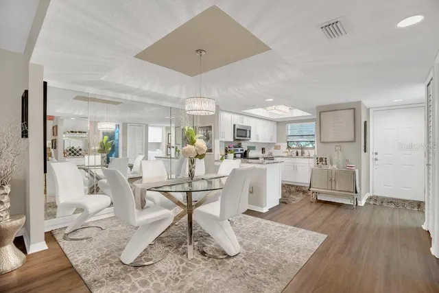 a living room with kitchen island furniture and a wooden floor