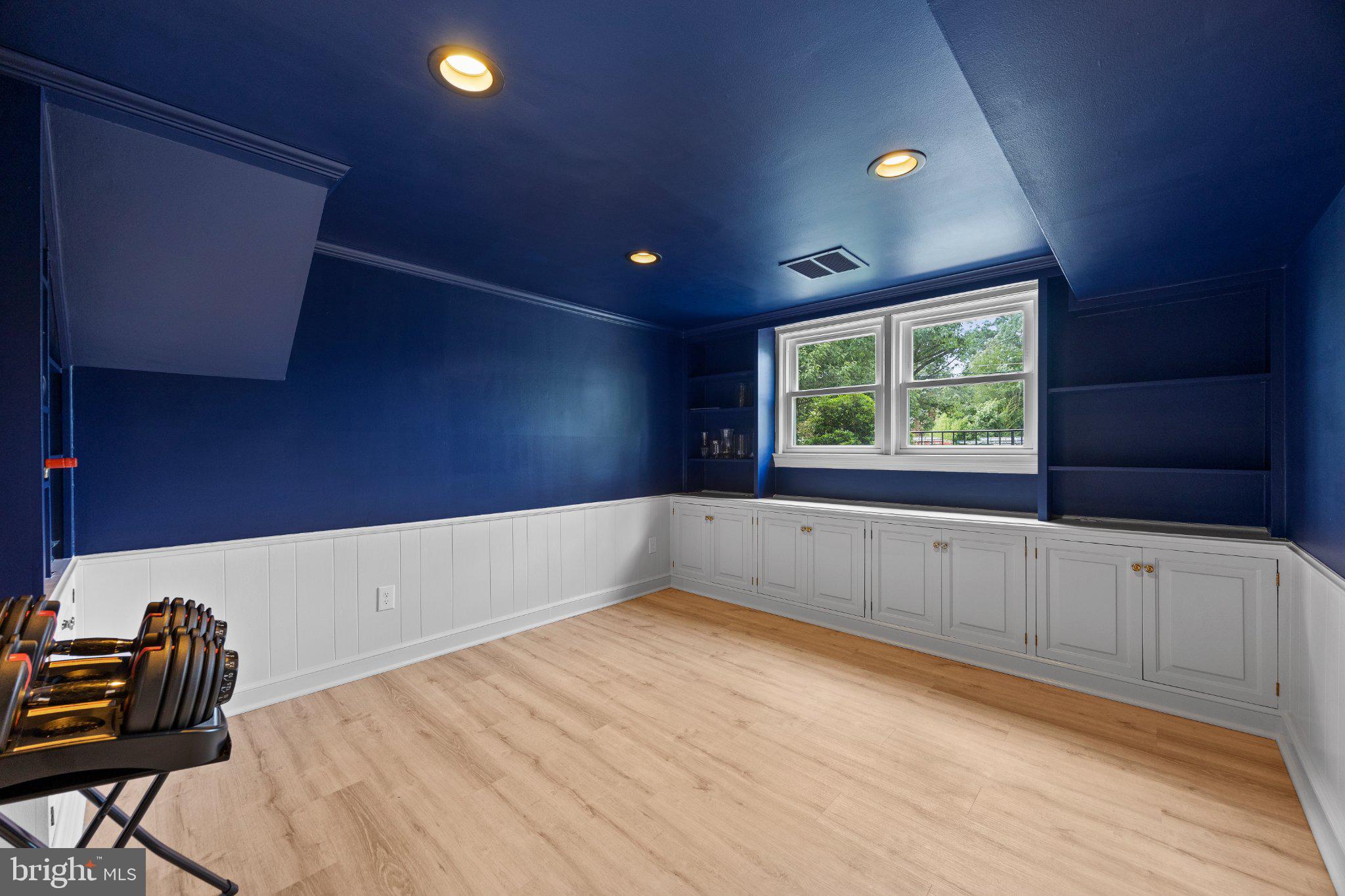 6705 New Hope Drive Springfield, VA 22151 - Photo 42 of 67 Versatile space with bold blue accents.