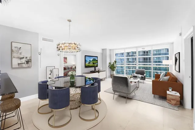 a living room with furniture a window and a table