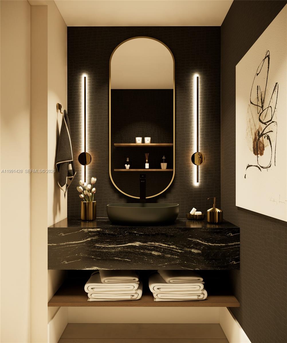 3021 Southwest 27th Street Miami, FL 33133 - Photo 21 of 40 a bathroom with a sink and a mirror