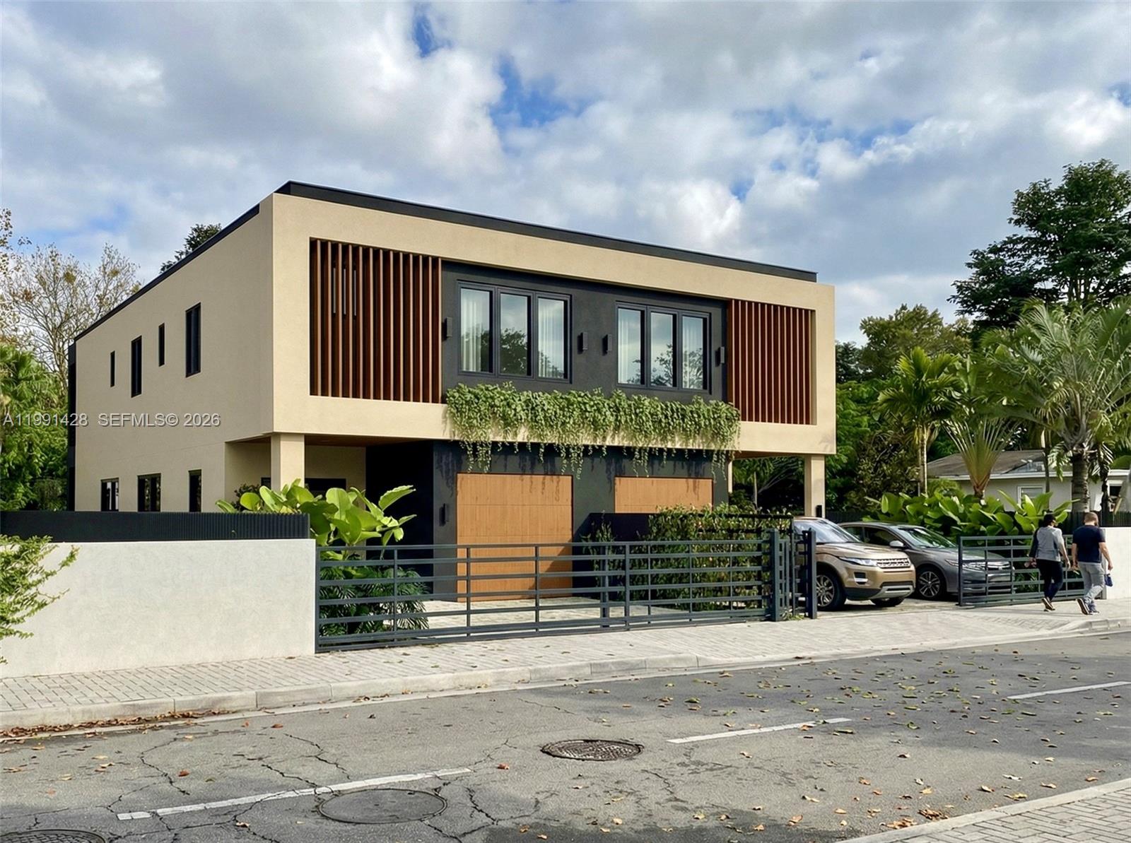 3021 Southwest 27th Street Miami, FL 33133 - Photo 5 of 40 a front view of a house with a garden