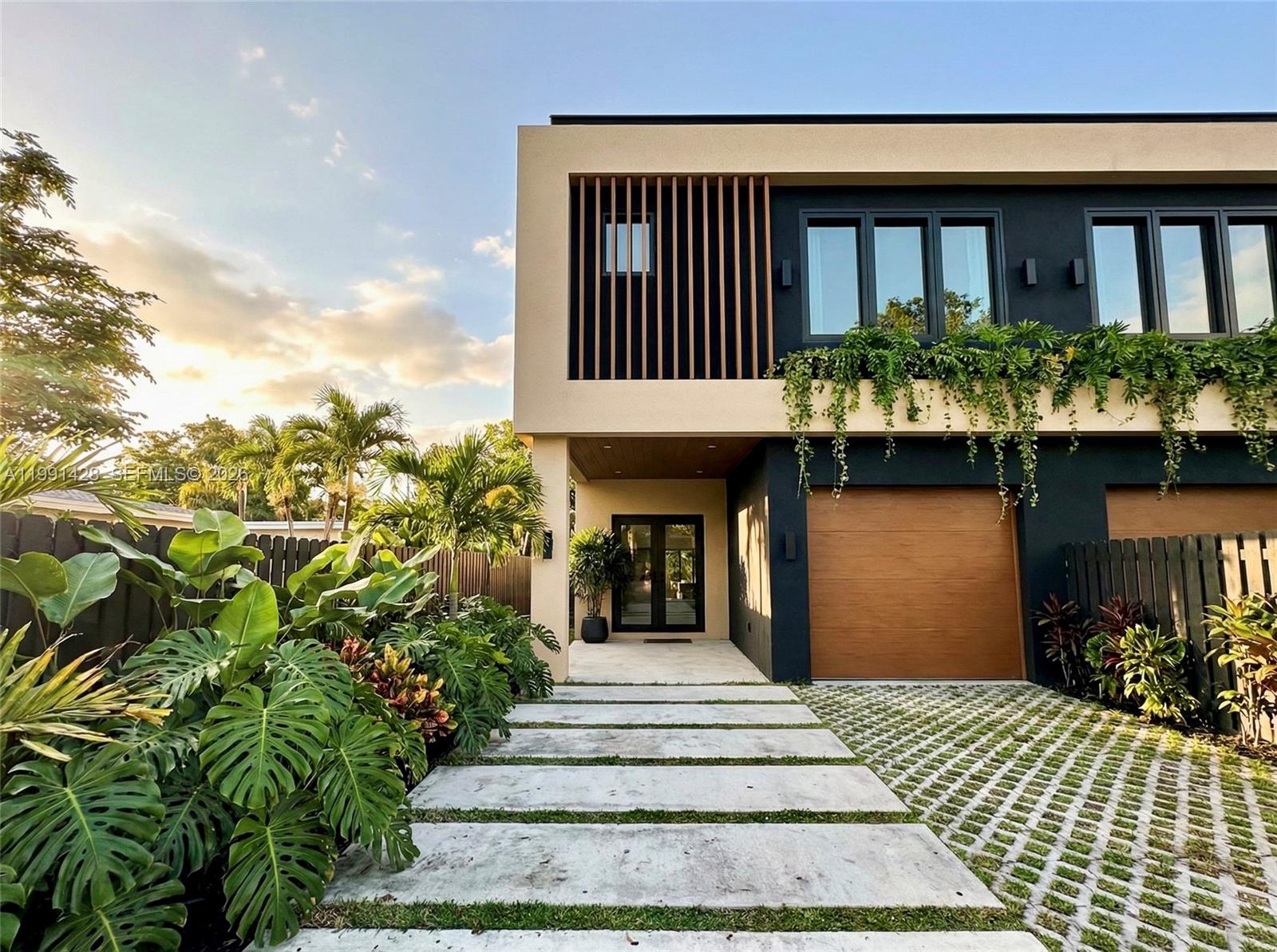 3021 Southwest 27th Street Miami, FL 33133 - Photo 6 of 40 a view of a brick house with plants and wooden floor
