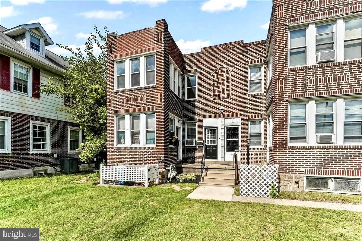 856 Chester Pike, Unit B Sharon Hill, PA 19079 - Photo 2 of 16 front view of a house with a yard