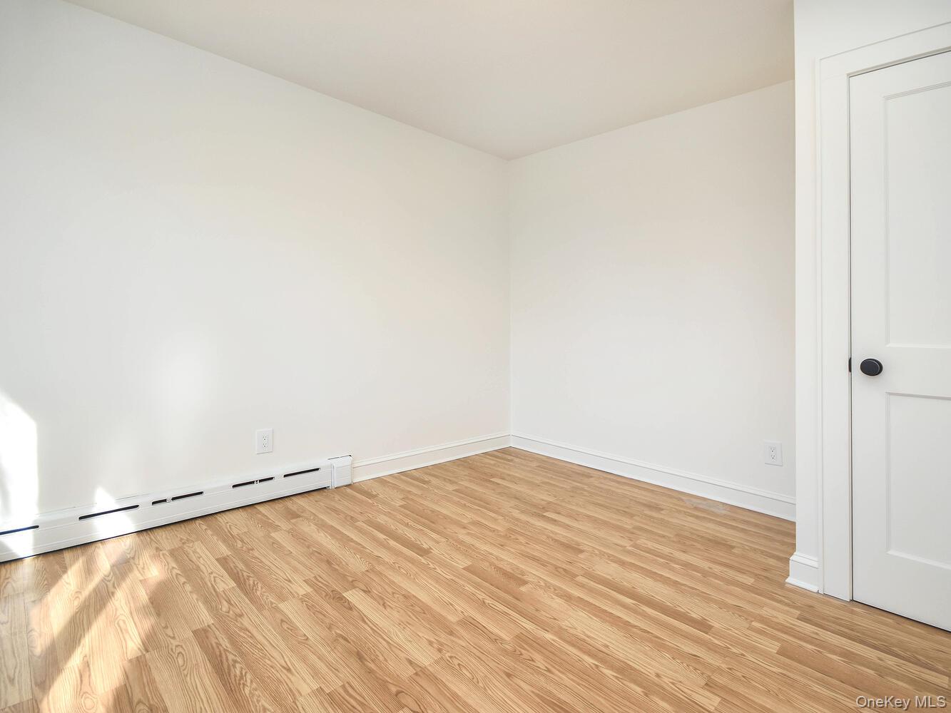 47 Edgewood Road Port Washington, NY 11050 - Photo 8 of 22 a view of empty room with wooden floor