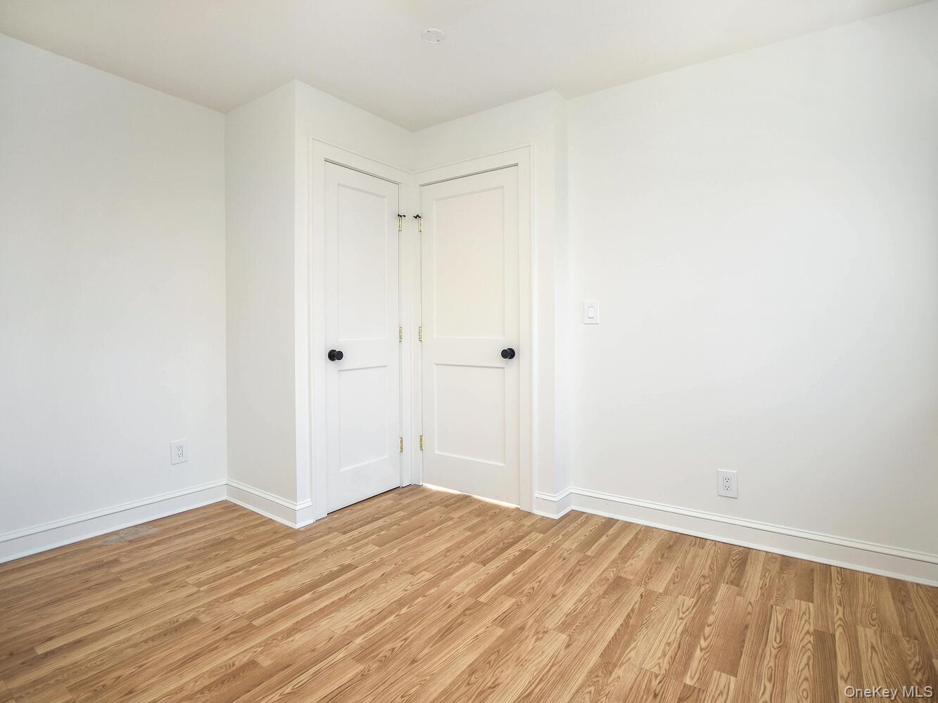 47 Edgewood Road Port Washington, NY 11050 - Photo 10 of 22 a view of empty room with wooden floor