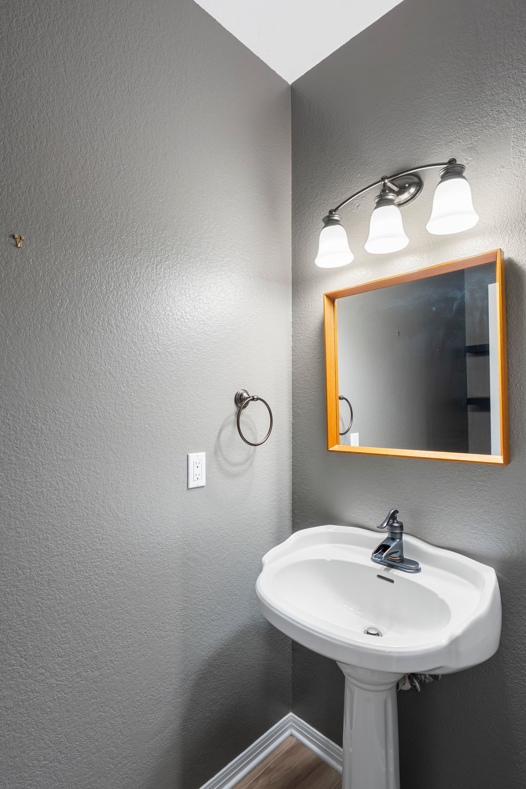 1406 Dapplegrey Lane Austin, TX 78727 - Photo 13 of 38 Bathroom featuring a textured wall and baseboards