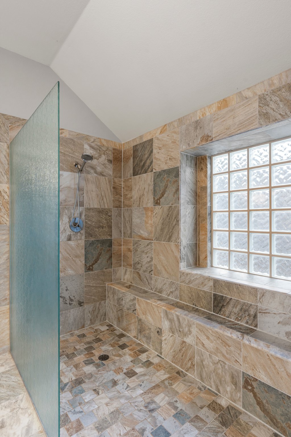 1406 Dapplegrey Lane Austin, TX 78727 - Photo 18 of 38 Full bathroom with a walk in shower and vaulted ceiling