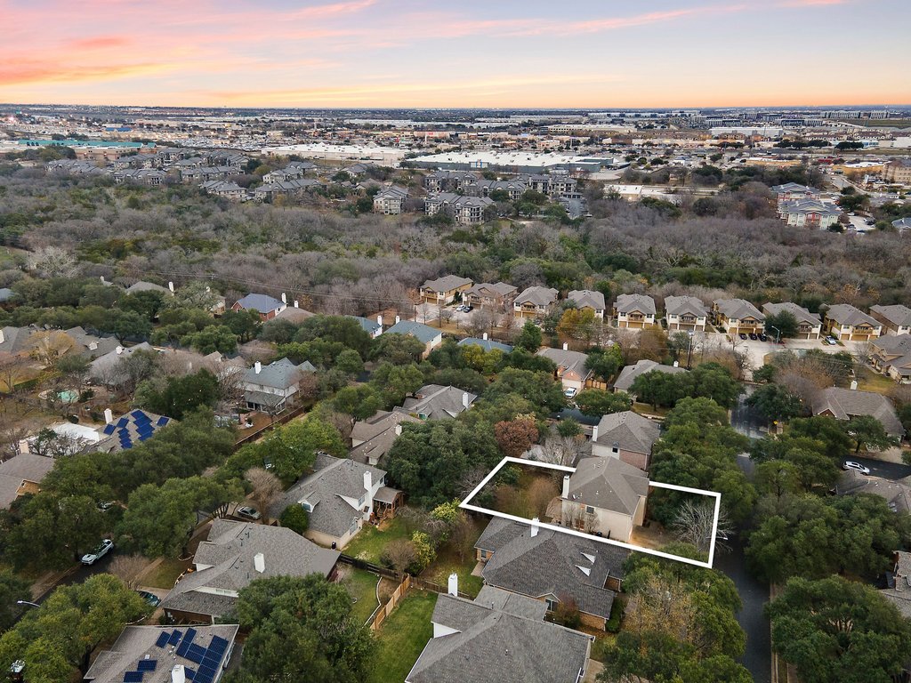 1406 Dapplegrey Lane Austin, TX 78727 - Photo 33 of 38 Aerial view at dusk of a residential view and property boundaries highlighted