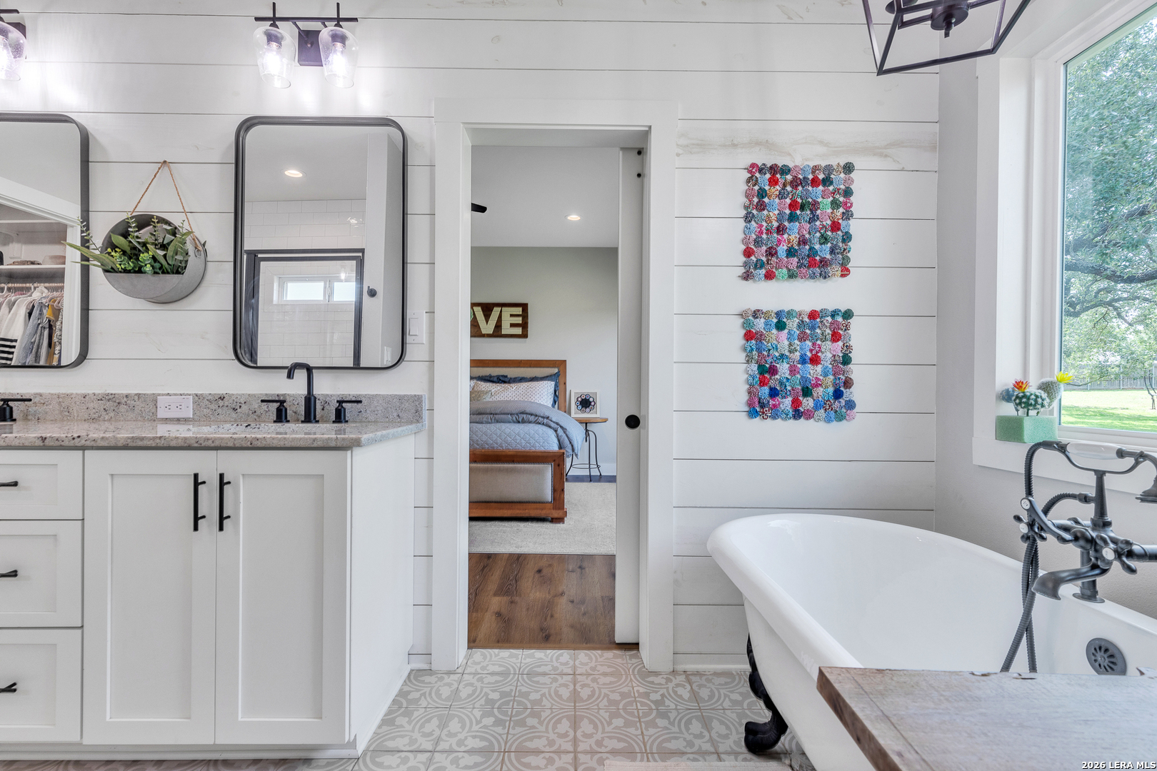 1026 Timbercrest Pleasanton, TX 78064 - Photo 17 of 37 a bathroom with a granite countertop tub sink and mirror