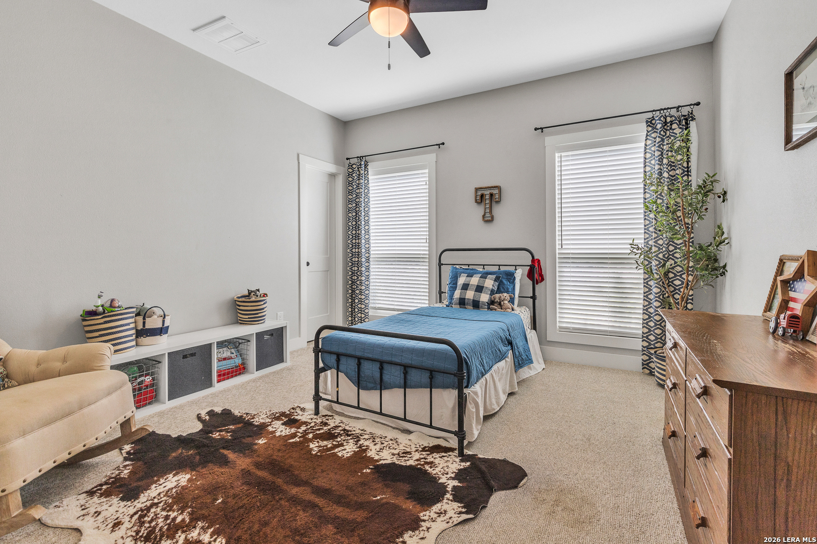 1026 Timbercrest Pleasanton, TX 78064 - Photo 19 of 37 a bedroom with a bed a table and chair