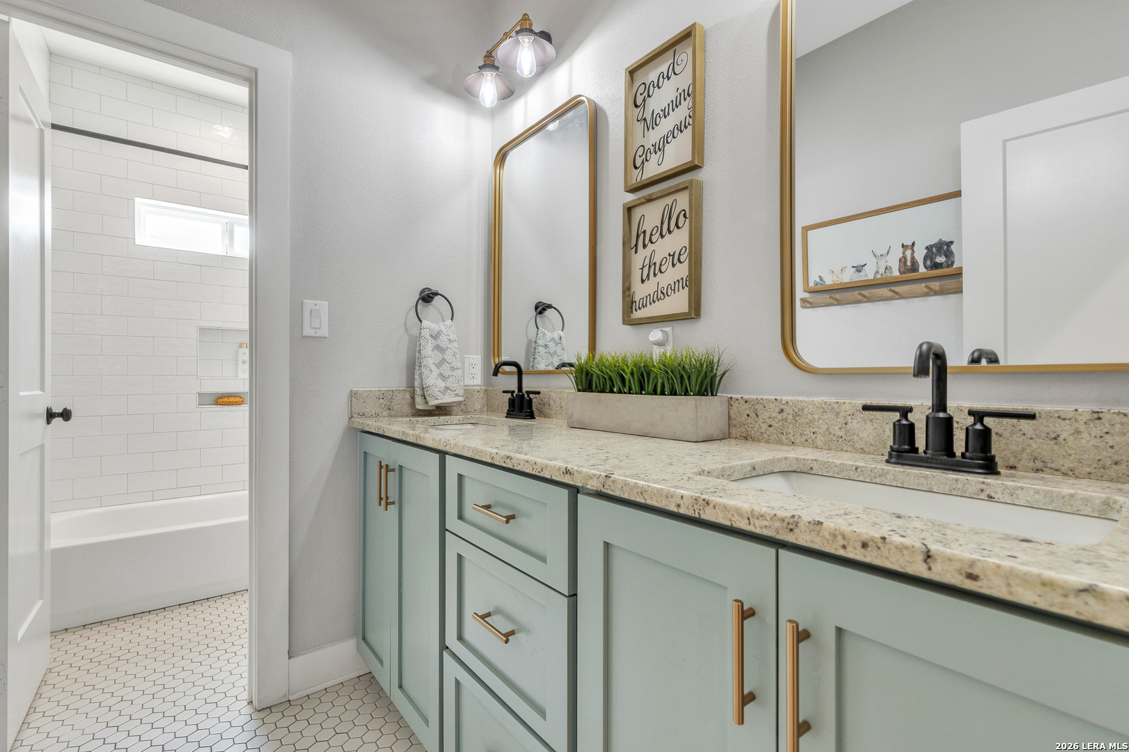 1026 Timbercrest Pleasanton, TX 78064 - Photo 22 of 37 a bathroom with a granite countertop sink mirror and a