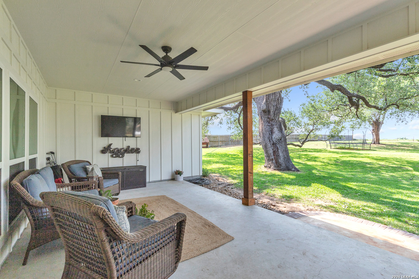 1026 Timbercrest Pleasanton, TX 78064 - Photo 28 of 37 a living room with furniture and a floor to ceiling window